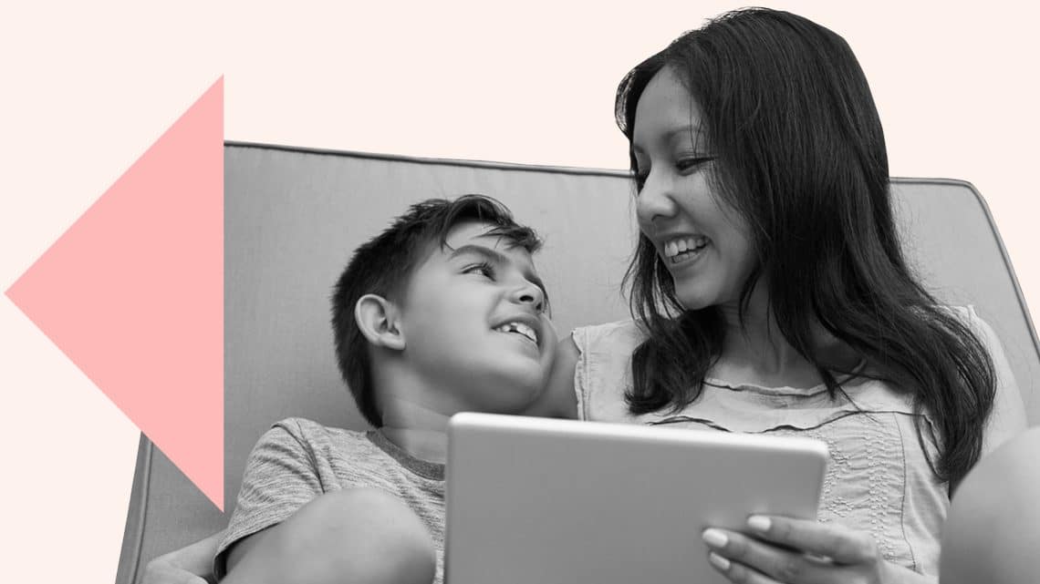 A mother and son using a tablet