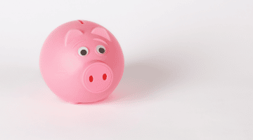 Image of a pink piggy bank sitting on a white background